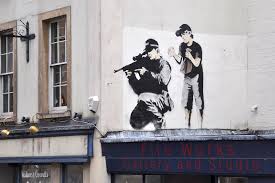 Sniper & Son – Banksy